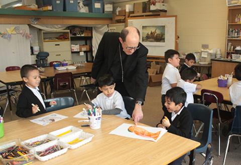 Bishop visits with San Juan students