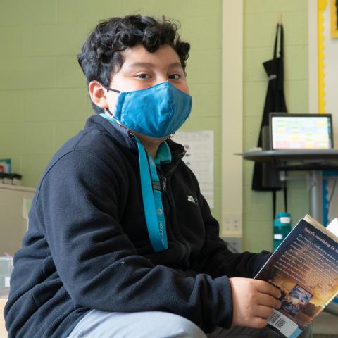 A student reads at St. Robert Catholic School.