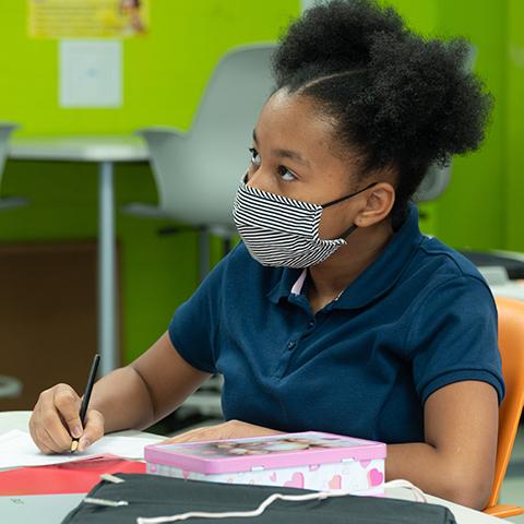 A student participates in class.